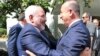 Turkish Foreign Minister Mevlut Cavusoglu, right, welcomes Iranian counterpart Mohammad Javad Zarif at the foreign ministry in Ankara, Aug. 12, 2016.
