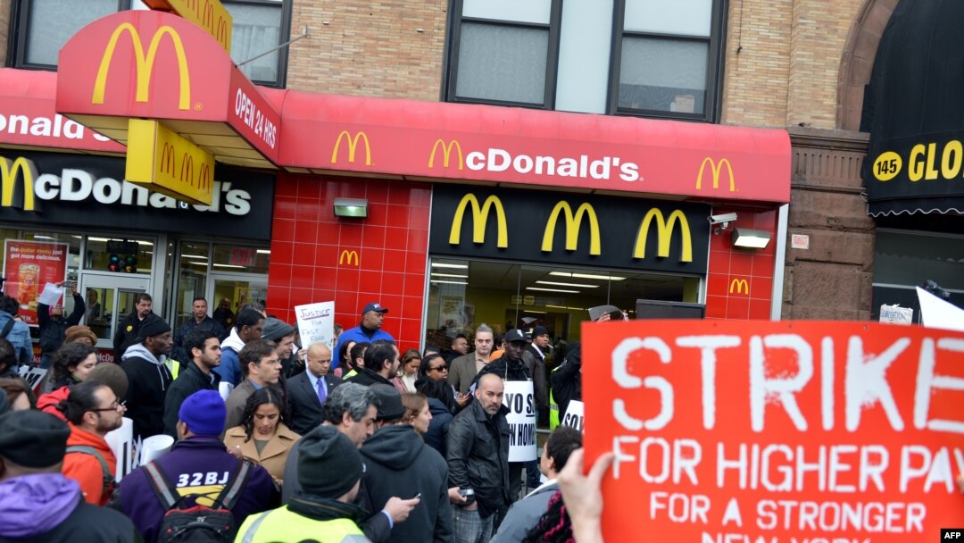 A coalition of groups rally in front of a McDonald's on East 125th Street and Lexington Avenue in Harlem during a protest by fast food workers and supporters for higher wages in New York, Apr. 4, 2013.