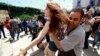 Police officers detain an activist from the women's rights group FEMEN during a protest against the arrest of their Tunisian member named Amina Sboui, in front of Tunisia's Ministry of Justice in Tunis, May 29, 2013.