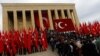 People rush to the entrance of the mausoleum of Mustafa Kemal Ataturk, during a ceremony marking his death anniversary, in Ankara, Turkey, Nov. 10, 2016.