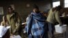 A Lesotho man wearing a traditional blanket prepares to vote at the Mpho primary school in Maseru, Lesotho, May 26, 2012.
