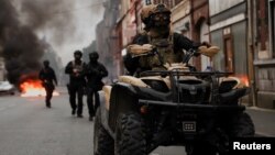 Fourth night of riots after teenager shot dead by police in Paris suburb