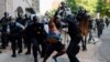 FILE - Police clear protesters from Lafayette Park and the area around it across from the White House for President Donald Trump to be able to walk to St. John's Church on June 1, 2020.