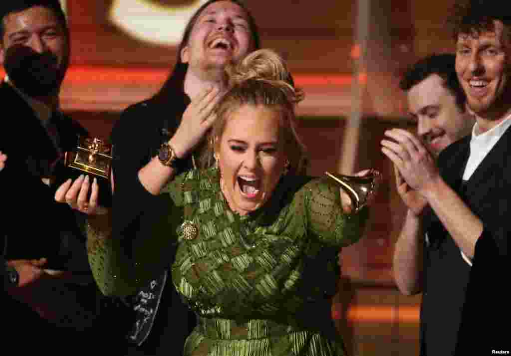 Adele breaks the Grammy for Record of the Year for "Hello" at the 59th Annual Grammy Awards in Los Angeles, California, Feb. 12, 2017.
