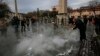 A municipal worker cleans the pavement at the site of Tuesday's explosion in the historic Sultanahmet district in Istanbul, Jan. 13, 2016. 