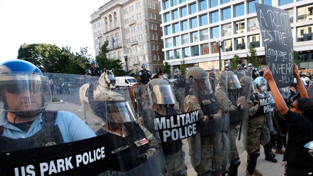 Police clear the area around Lafayette Park and the White House as demonstrators gather to protest the death of George Floyd, June 1, 2020, in Washington. Floyd died after being restrained by Minneapolis police officers. 
