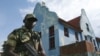 A soldier stands guard at an M23 rebel training camp in Rumangabo, eastern Congo, Oct. 23, 2012. 