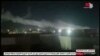 This image grab taken from a broadcast by Syria TV on June 28, 2021, shows smoke billowing from a facility used by Iran-backed groups following U.S. airstrikes on the Syrian-Iraqi border. 