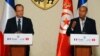 Tunisian President Moncef Marzouki , right, addresses reporters during a joint press conference with French President Francois Hollande, left, Carthage, Tunisia, July 4, 2013.