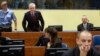 Franko Simatovic (top R), former commander of the Special Operations Unit of the Serbian State Security Service, and Jovica Stanisic (top C), former chief of Serbian State Security, sit in court prior to the Trial Chamber Judgement at the International Cr