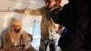 Saif al-Islam Gadhafi is pictured sitting in a plane in Zintan, Libya, November 19, 2011.