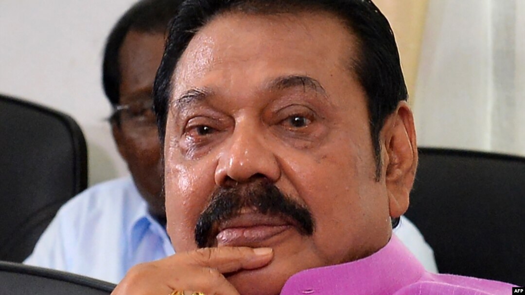 FILE - Sri Lankan former President Mahinda Rajapakse addresses journalists at his residence in Colombo, Sept. 22, 2018. Rajapakse has been appointed the Sri Lanka's new prime minister. 