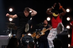 In this photo taken on Saturday, Nov. 11, 2017, musician Johnny Clegg on stage at a farewell concert in Johannesburg.