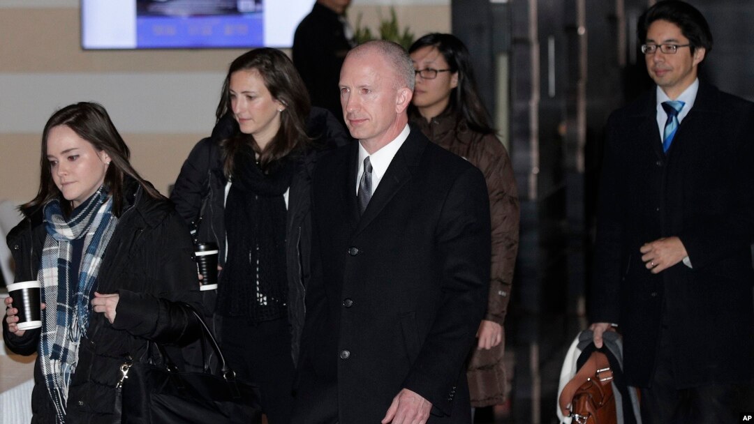 Deputy U.S. trade representative Jeffrey D. Gerrish, center, and members of his delegation leave the Westin hotel in Beijing, China, Jan. 7, 2019, for talks with their Chinese counterparts.