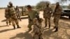FILE - A U.S. special forces soldier demonstrates how to detain a suspect during Flintlock 2014, a U.S.-led international training mission for African militaries, in Diffa, March 4, 2014.