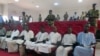 FILE - A picture taken Aug. 26, 2015 shows suspected members of Boko Haram sitting in court in N'Djamena. 