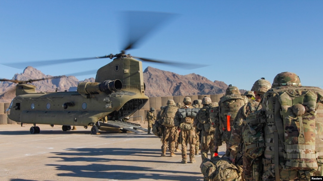 FILE - U.S. soldiers, part of a NATO-led force, load onto a Chinook helicopter to head out on a mission in Afghanistan, Jan. 15, 2019.
