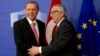 Turkish President Recep Tayyip Erdogan, left, is greeted by European Commission President Jean-Claude Juncker prior to a meeting at EU headquarters in Brussels, Belgium, Oct. 5, 2015. 