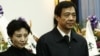 China's former Chongqing Municipality Communist Party Secretary Bo Xilai (R) and his wife Gu Kailai.