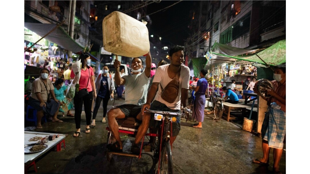 People attend a night protest against the military coup in Yangon, Myanmar, Feb. 5, 2021.