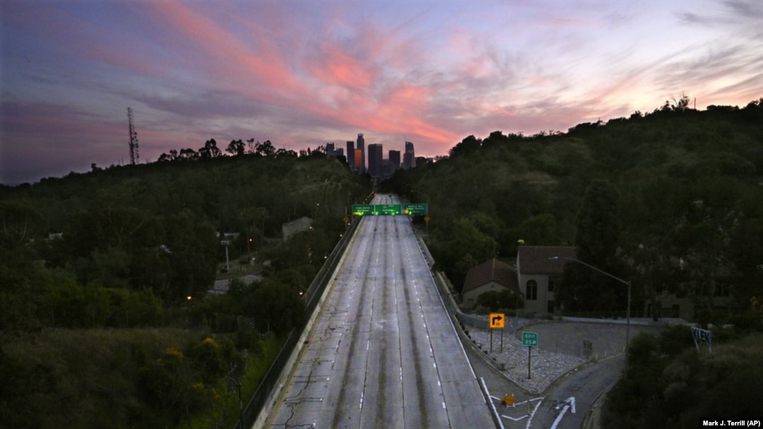 FILE - In this April 26, 2020, file photo, empty lanes of the 110 Arroyo Seco Parkway that leads to downtown Los Angeles is seen during the coronavirus outbreak in Los Angeles, Calif. (AP Photo/Mark J. Terrill, File)