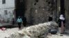 People emerge from their homes following the lifting of a curfew in the mainly Kurdish town of Cizre, Turkey, Sept. 12, 2015.