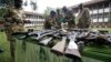 FILE - Kenya Wildlife Service officials inspect illegally held firearms recovered from poachers, at their headquarters in Kenya's capital Nairobi, June 22, 2012.