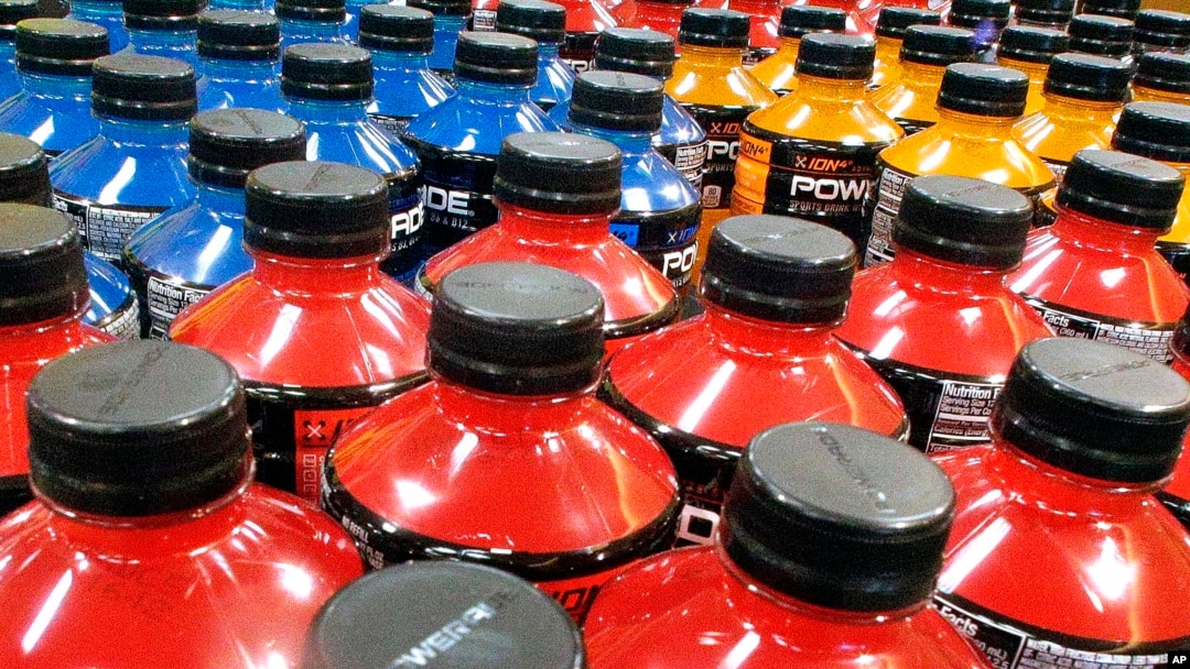 FILE - Sodas and energy drinks line the shelves in a grocery store in Springfield, Illinois, May 18, 2016. The World Health Organization recommends countries use tax policy to increase the price of sugary drinks as a way to fight obesity and diabetes.