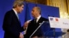 U.S. Secretary of State John Kerry, left, shakes hands with French Minister of Foreign Affairs Laurent Fabius, Paris, Feb. 27, 2013.