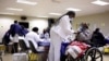 A woman receives a dose of a coronavirus disease (COVID-19) vaccine, as South Africa rolls out the coronavirus disease (COVID-19) vaccination to the elderly at the Munsieville Care for the Aged Centre outside Johannesburg, South Africa May 17, 2021.