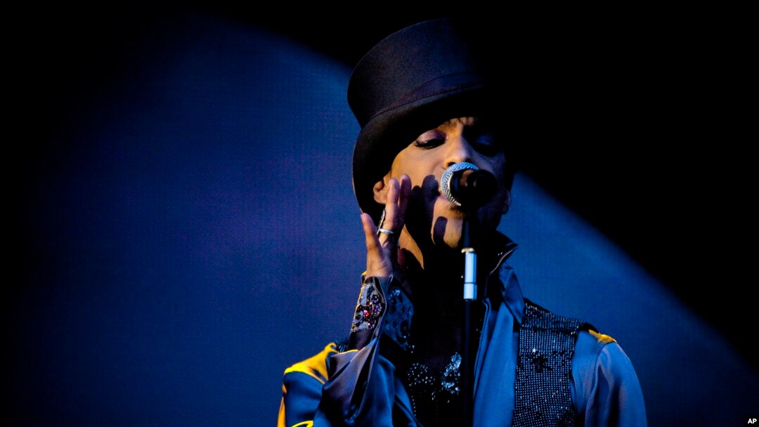 FILE - American singer and songwriter Prince performs on the Isle of Amager in Copenhagen, Denmark, Aug. 6, 2011. 