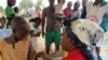 FILE - A child receives a measles vaccine in a camp set up by the UNHCR in Nangungue, Cameroon, April 12, 2013.