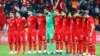 Turkey's players observe a minute of silence for the victims of the Paris attacks before their soccer match Nov. 17, 2015, against Greece in Istanbul.