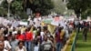 Kenyan demonstrators display placards during a protest, in Nairobi, Kenya, May 14, 2013.
