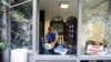 A man removes stones at the Thai honorary consulate in Istanbul, Turkey, July 9, 2015.