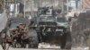 FILE - Government soldiers take cover during a firefight with Muslim rebels from the Moro National Liberation Front (MNLF) in Zamboanga city in southern Philippines September 12, 2013.