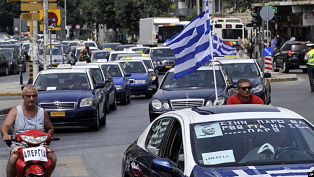Striking taxi drivers protest part of the country's fiscal recovery program by driving their cars in convoy through the streets of Thessaloniki, Greece, July 20, 2011