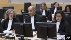 Representatives of the Office of the Prosecutor at the start of a two-day ICC hearing on where to try the eldest son of former Libyan dictator Moammar Gadhafi, The Hague, Oct. 9, 2012.
