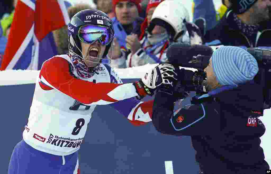 Britain's Dave Ryding celebrates his second place after completing an alpine ski, men's World Cup slalom, in Kitzbuehel, Austria.