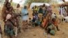 Nigerian refugees, who fled from their village into Niger following Boko Haram attacks, stand in the yard of their Nigerien host in Diffa in southeastern Niger, June 21, 2016. 