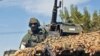 A French elite Special Operations soldier drives through the town of Markala, about 275 km (171 miles) from the capital Bamako, January 15, 2013, to meet Malian soldiers and organize a counter-attack in the jihadist-held town of Diabaly. 