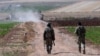 FILE - Turkish soldiers patrol near the border with Syria in southeastern Turkey, July 24, 2015.