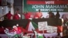 Ghanian President John Dramani Mahama, center left, speaks to ruling party supporters at his final campaign rally ahead of Friday's presidential election, in Accra, Ghana, December 5, 2012. 