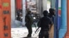 Haiti's prime minister orders gangs to drop weapons and promises to take back control of the capital