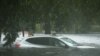 A vehicle is submerged in flood waters in Jourdan River Shores neighborhood as Hurricane Isaac passes through Kiln, Mississippi, August 29, 2012. 