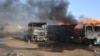 Burnout petrol tankers following a suicide attack in Maiduguri, Nigeria, March 3, 2017. Three suicide bombers set ablaze three fuel tankers in the center of Nigeria's northeastern city of Maiduguri before dawn, officials said,