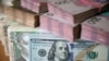 U.S. dollar and Ukrainian hryvnia bills are seen in this picture illustration taken in Kyiv, Ukraine, Oct. 31, 2016.