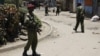 Kenyan police guard the scene following an explosion at a church in Nairobi, Kenya, September 30, 2012.
