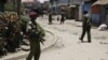Kenyan police guard the scene following an explosion at a church in Nairobi, Kenya, September 30, 2012.