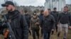 International Criminal Court Prosecutor Khan and Ukraine's Prosecutor General Venediktova visit a site of a mass grave in the town of Bucha